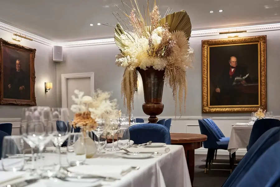The portrait-lined dining room at The Royal Exchange of Sydney